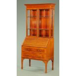 An Edwardian inlaid mahogany bureau bookcase,