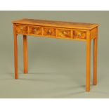 A walnut five drawer hall table,