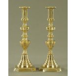 A large pair of Victorian polished brass candlesticks. Height 30 cm.