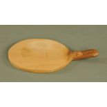 A Mouseman Thompson of Kilburn oak oval bread board, with typical mouse trademark,