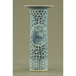 A 19th century Chinese export blue and white cylindrical vase, with flared lip decorated with birds,
