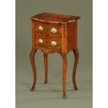 A Continental walnut veneered serpentine fronted two drawer chest, with Limoges porcelain panels,