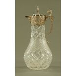 A cut glass silver plated claret jug. Height 31 cm.