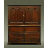 An 18th century oak livery cupboard,