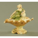 A Royal Dux clam shell bowl with seated draped female figure,