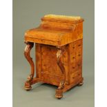 A Victorian walnut piano front Davenport,