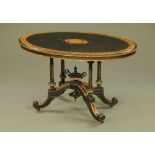 A Victorian oval aesthetic movement inlaid and ebonised centre table,