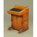 A Victorian walnut Davenport desk, with rear stationery compartment,