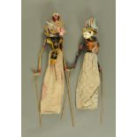 Two Indonesian puppets, hand painted over wood. Length to bottom of dress 64 cm.