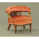 A late Victorian/ Edwardian walnut ladies tub chair,