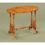A Victorian walnut oval stretcher table,
