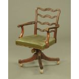 A mahogany Hepplewhite style revolving desk chair,