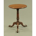 A George III style mahogany tripod table, with fixed top,