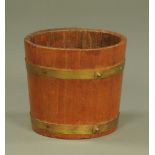 An early 20th century metal bound half barrel planter. Height 24 cm, diameter 26 cm.