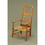 A 19th century bobbin turned rush seated armchair.