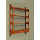 A Georgian style mahogany hanging shelf unit with three drawers to base. Height 92 cm, width 69 cm.