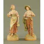 A pair of Royal Dux figures, boy and girl,