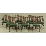 A set of two carver arm and eight single Edwardian Chippendale style mahogany dining chairs,