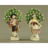 A pair of Continental porcelain, lady and gentleman with bocage. Height 17 cm.