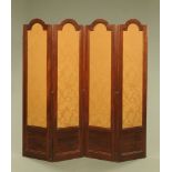 A Victorian mahogany framed four fold screen, with arched top and fabric covered panels.