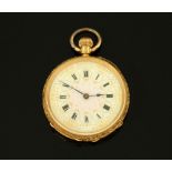An 18 ct gold foliate engraved fob watch, with ceramic dial, knob wind, diameter 38 mm.