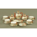 A Japanese Satsuma part tea service, six saucers, five cups, sugar basin,