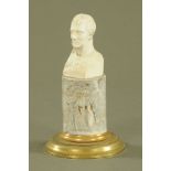 A Parian bust of the King of Prussia, raised on a marble and brass plinth. Height 20 cm.