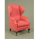 A mahogany wing easy chair, in the Queen Anne style,