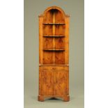 A yew wood standing corner cabinet,