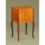 A mahogany foliate marquetry three drawer bedside cabinet, raised on cabriole legs.