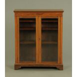 An Edwardian inlaid mahogany display cabinet with satinwood banding, boxwood strung,