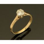 A 9 ct yellow gold solitaire diamond ring, Size M/N.