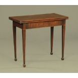 An early 19th century mahogany turnover top card table,