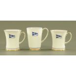 Three Shelley beakers, each with yacht pennant. Tallest 13 cm.