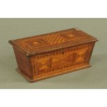 A 19th century parquetry tea caddy, with three lidded interior compartments. Width 33 cm.