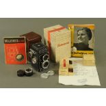A boxed Rolleicord Range Finder camera, together with a variety of mixed Rolleiflex accessories.