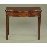 A George III style mahogany serpentine fronted turnover top tea table,