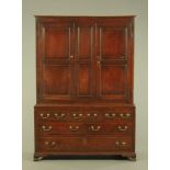 An 18th century oak livery cupboard,