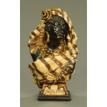 A Moroccan ware bust, a female figure wearing a head scarf, cream,