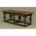 A large Elizabethan style oak refectory or serving table,