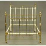 A Victorian white painted metal and brass bed, with irons and spring interior.