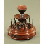 A Victorian mahogany bobbin and thimble stand. Diameter 21 cm.