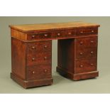A Victorian well figured mahogany pedestal desk,