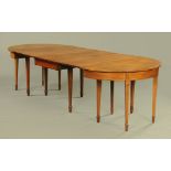 A 19th century mahogany dining table, with centre drop leaf section and pair of D ends,