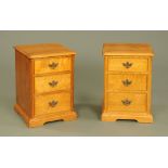A pair of oak bedside cabinets,