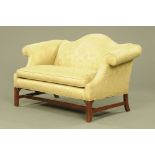 A Chippendale style settee, with arched back,