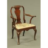 A George I mahogany armchair, in the Queen Anne style with splat back, shaped arms,