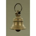 An antique bronze bell with hanger. Height excluding hanger 15 cm, base diameter 13.25 cm.