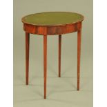 A George III mahogany oval leather topped occasional table, with tapered legs of square section.