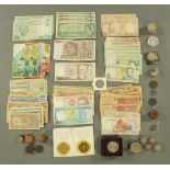 A collection of miscellaneous coins and banknotes, some silver others gilt,
